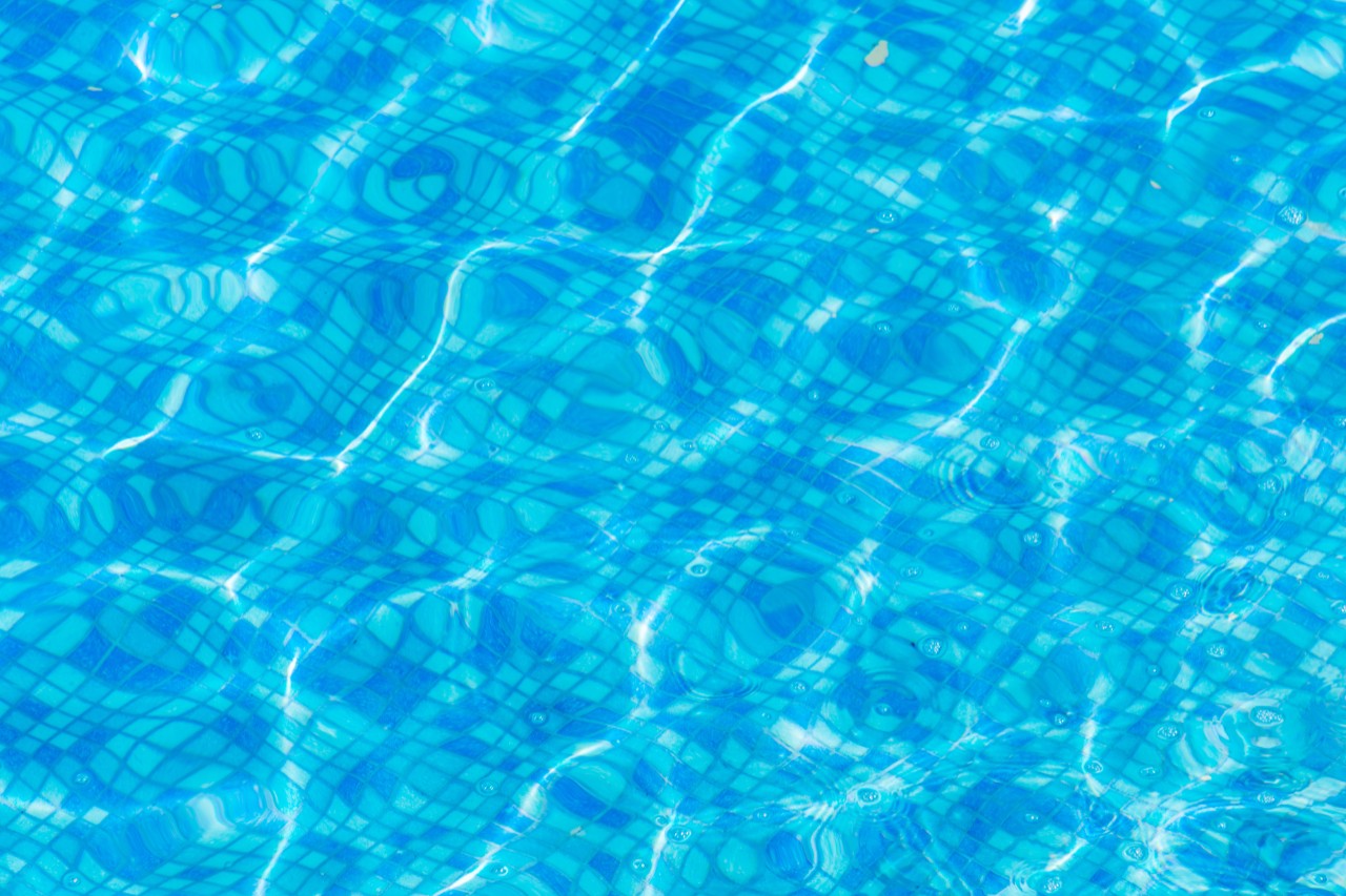 Texture of blue water in the pool