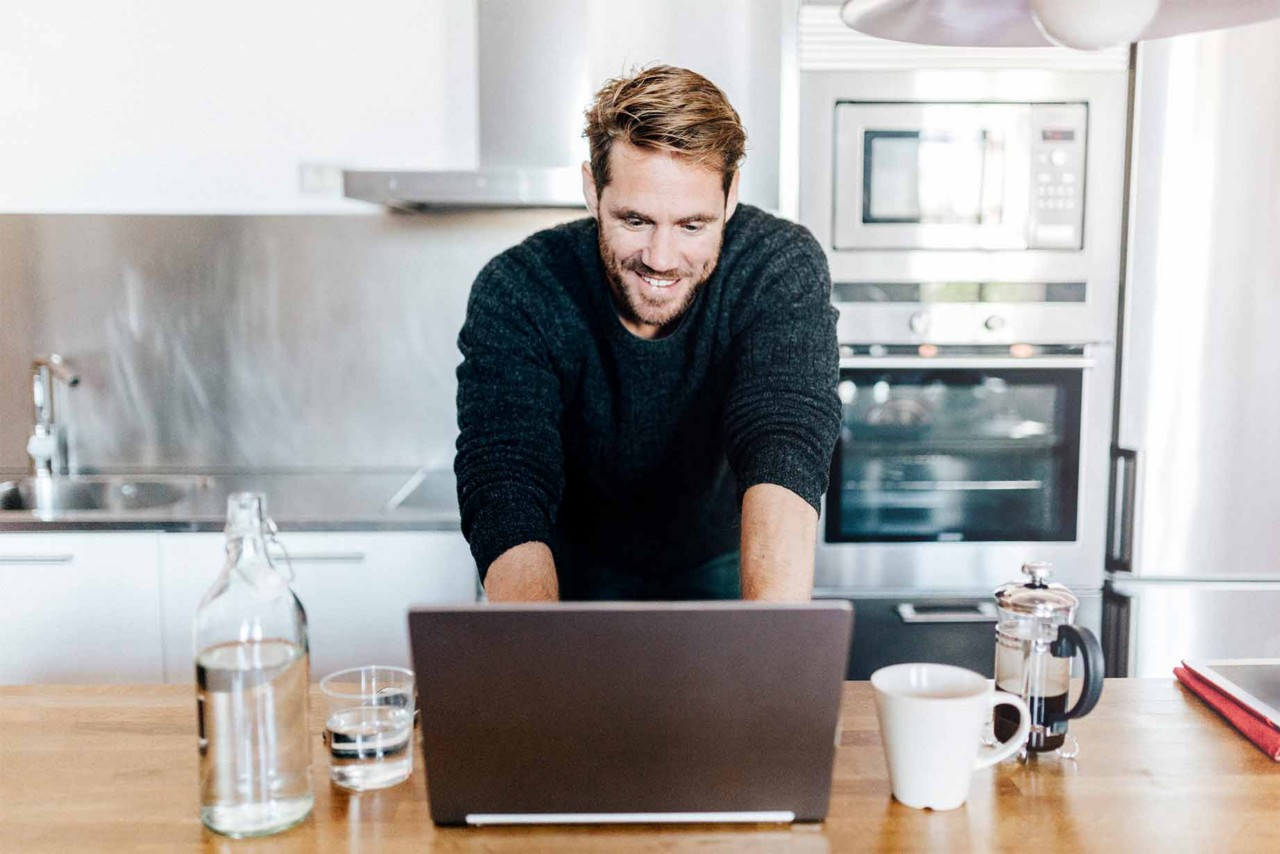 customer using computer in kitchen