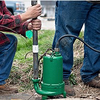 men installing pump
